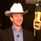 Jeff Bezos holds a cordless power drill and reciprocating saw at a New York press conference on November 9, 1999.